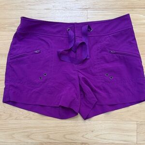 Athleta Vibrant Purple Swim Shorts with zippered
Pockets size 2